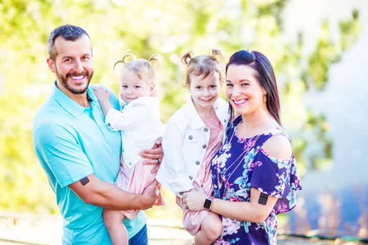 Christopher and Shanann Watts with their daughters, Bella and Celeste. Christopher was taken into custody in connection with the murder of his family.