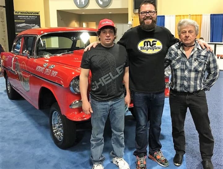 Rutledge Wood, co-host of “Top Gear” on The History Channel, with Chuck Wanamaker III, left, and Chuck Wanamaker Jr. at the Keystone Big Show East. They&#x27;re standing in front of the Wanamakers&#x27; &#x27;55 Chevy.