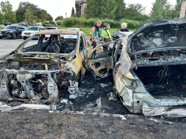 Officials in Sussex County are investigating the cause of a massive fire that ripped through several vehicles in a local parking lot over the weekend.
