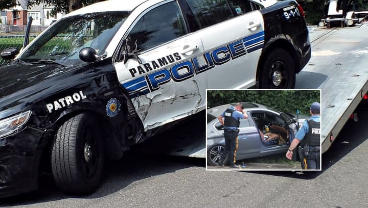 This Paramus police cruiser, another and the pursued stolen BMW sedan were all towed from the scene just off Route 17.
