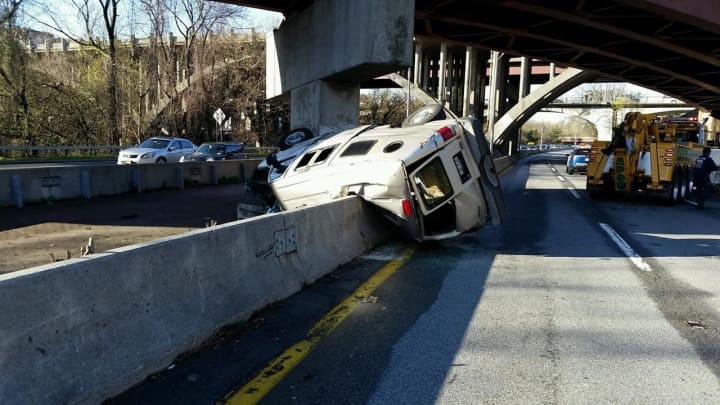 A van drove off the Cross County Parkway overpass and landed in the median of the Bronx River Parkway.