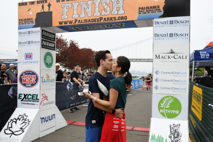 Moments after crossing the finish line, Thomas Susarchick proposes to girlfriend Ariel Hidalgo at Rock the River Race in Fort Lee.