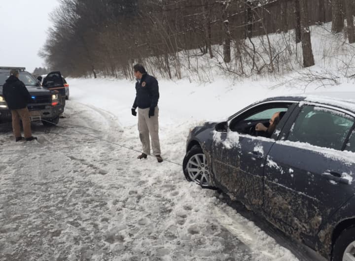 Gov. Andrew Cuomo helps a stranded driver on a stretch of the Sprain Brook Parkway near Hawthorne during the mid-February snowstorm.