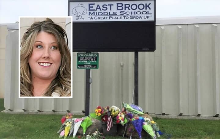 Flowers and candles were left at East Brook Middle School honoring teacher Jennifer Williamson (inset) and a fifth-grader killed Thursday in a school bus crash on Route 80.