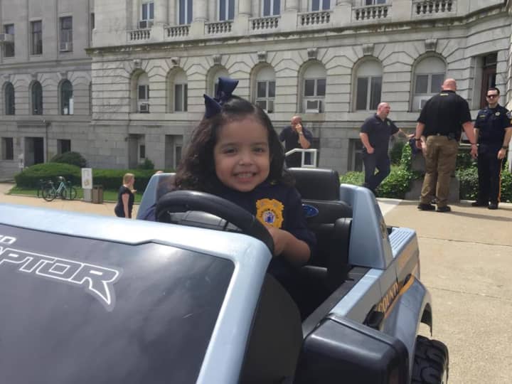 Fairview Chief Isabel, 4, takes the mini Sheriff&#x27;s Department vehicle for a spin.