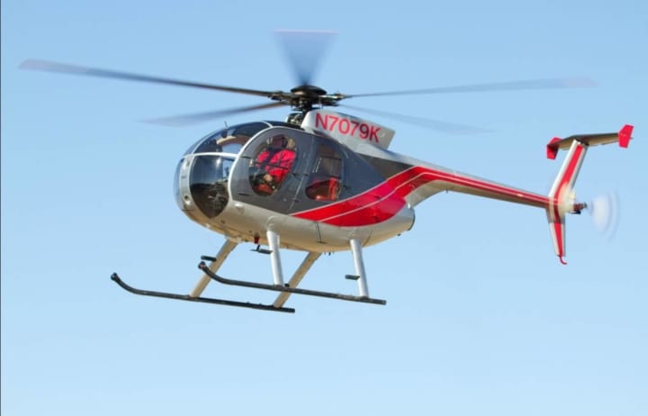 This helicopter will be carrying a large saw and flying over several towns in Hartford and Tolland Counties for more than a week in order to trim trees.