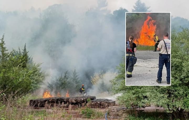 The fire, which continued to smolder late Saturday afternoon well into Sunday, was on a 570-acre strech of property known as one of New Jersey&#x27;s most polluted.