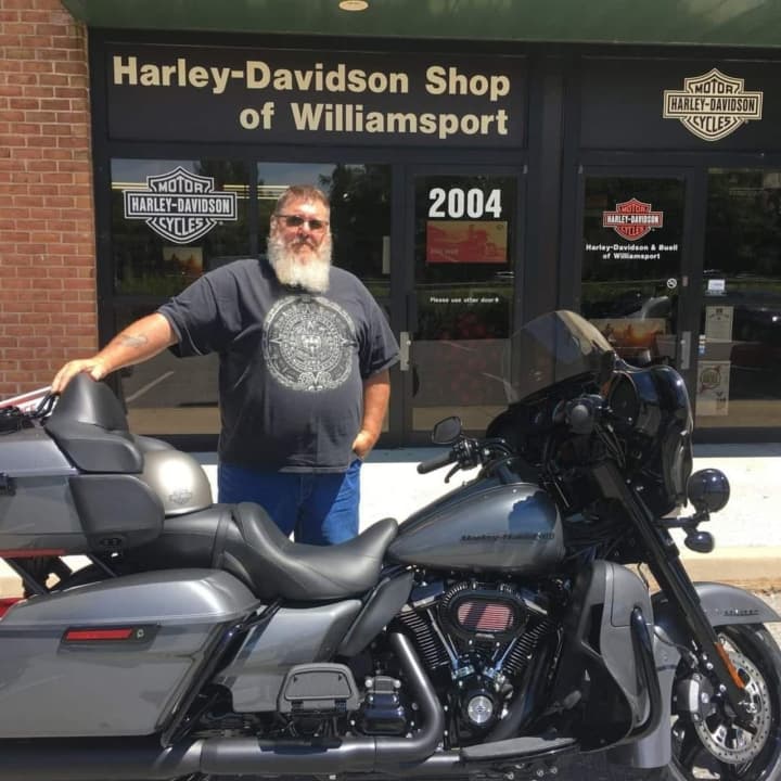 Troy Kahlet and his Harley Davidson.
