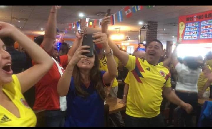 GOAL! Noches of Colombia erupts in celebration as Colombia advances in the World Cup.
