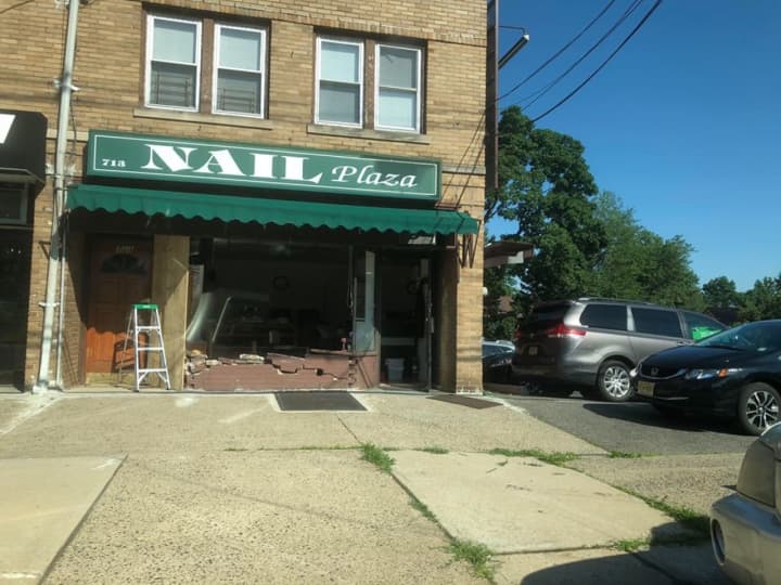 One of three people in a car that crashed into a nail salon on Teaneck Road just after noon Thursday was taken across the street to Holy Name Medical Center, police said.