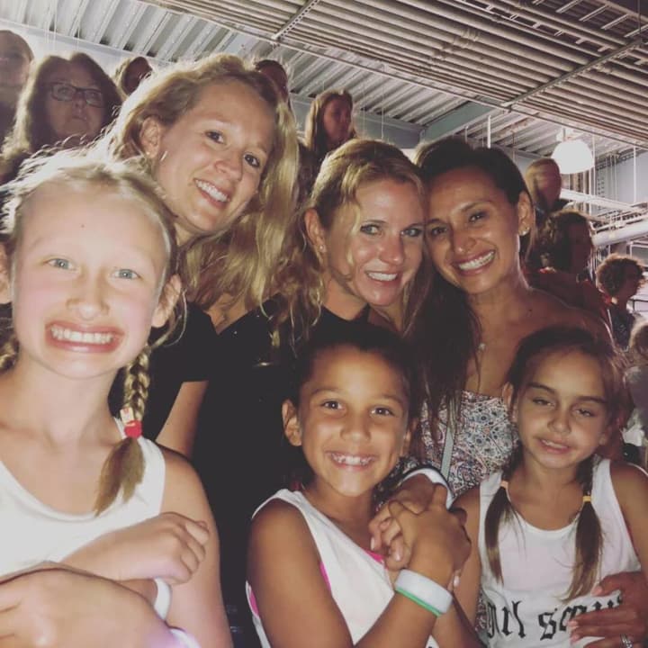Hillsdale Girl Scouts and their moms enjoy a free Taylor Swift concert.