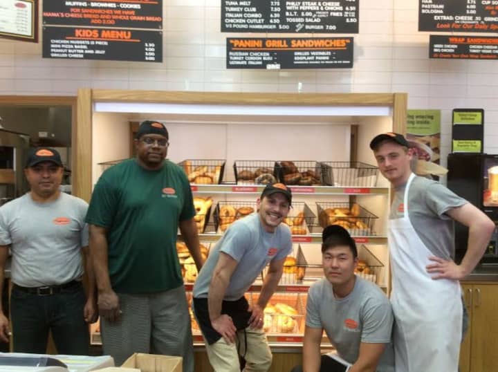 The crew at Bagelman takes a break from baking to show off the wide selection of bagels at the Brookfield and Danbury locations.