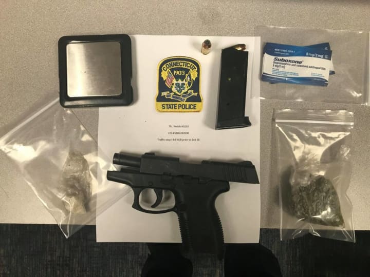 Connecticut State Police troopers seized a stolen weapon and drugs during a stop on I-84.