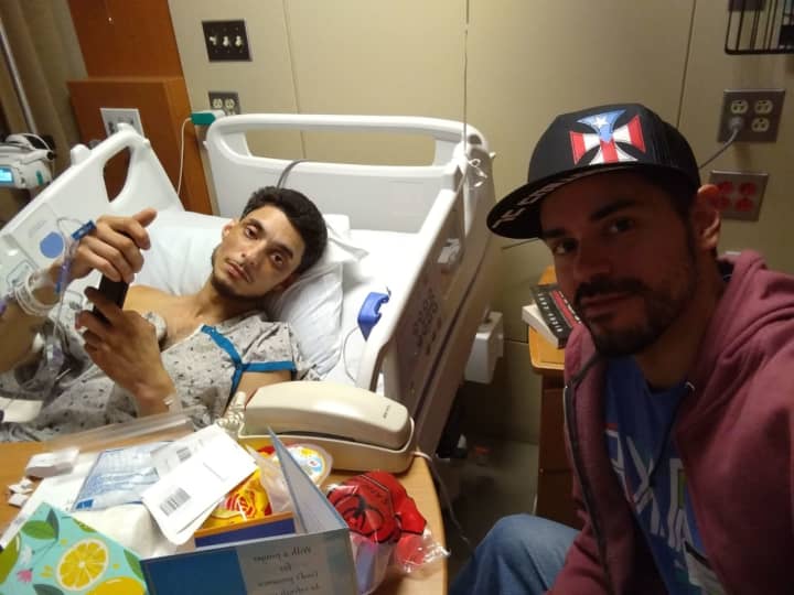 Selwyn Torres recovers at Morristown Medical Center with his brother, Xavier Martinez.
