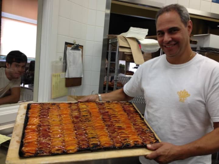 John Barricelli of SoNo Baking Company &amp; Cafe pictured with one of his famous desserts.