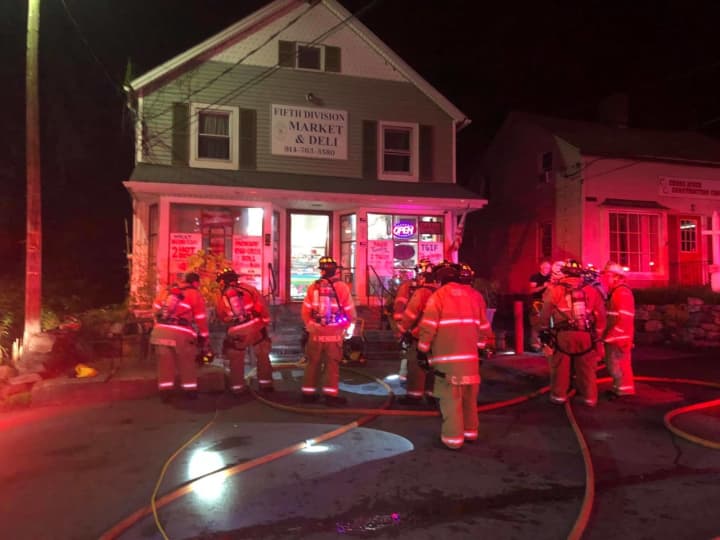 Burnt food that filled a deli with smoke brought out numerous fire departments.