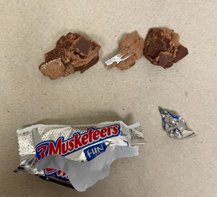 The girl found a blade in a mini 3Musketeers bar.