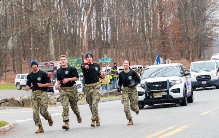 It’s fitting that a group of marathoners from the U.S. Naval Academy are running a game ball all the way up to the home of the New England Patriots for this weekend’s rivalry match with the U.S. Military Academy.
  
