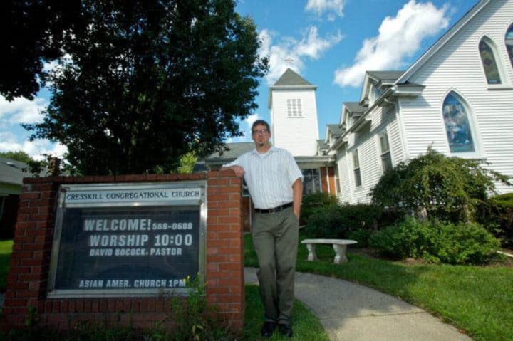 Rev. Dr. David C. Bocock stands outside Cresskill Congregational Church, UCC.