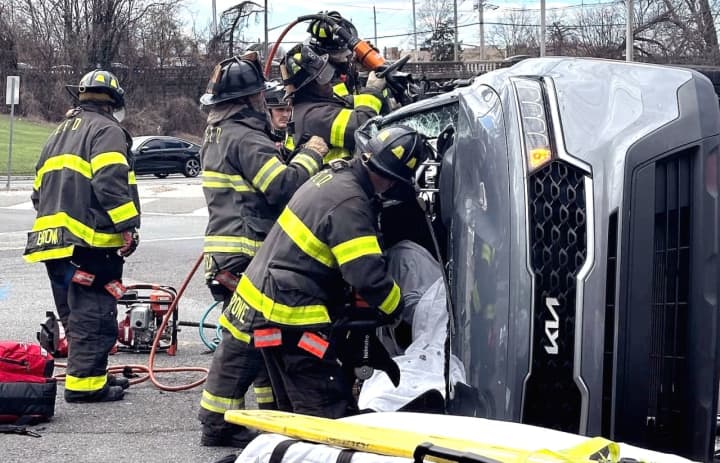 Englewood firefighters freed a passenger in an SUV that got knocked onto its side after the driver ran a red light with her 5-year-old son in the back seat on Sunday, April 7, authorities said.
  
