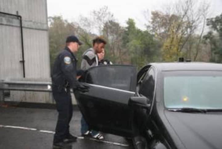 John Paul Suero as he was taken into custody.
