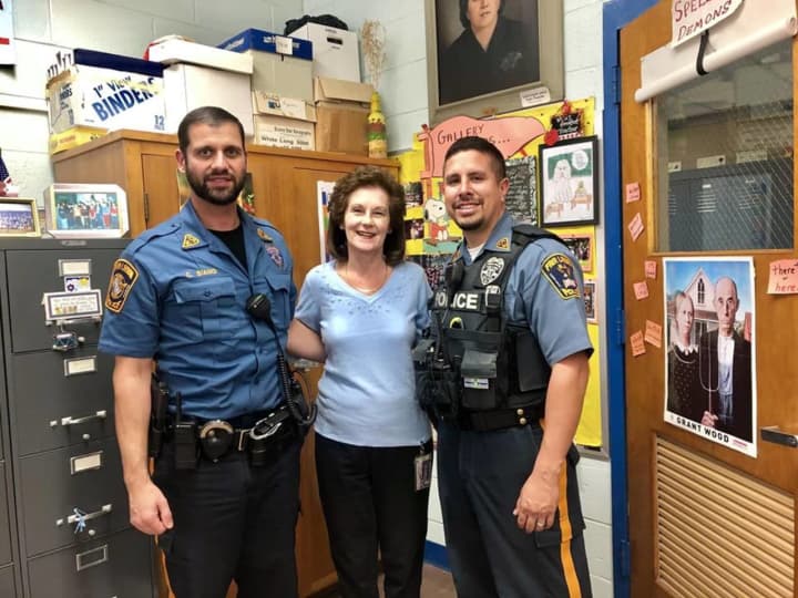 Fair Lawn Police Officers Chris Siano and Luis Vazquez with Yvonne Visocky.