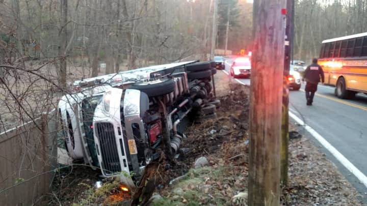 A milk truck rolled over while attempting to avoid a school bus.