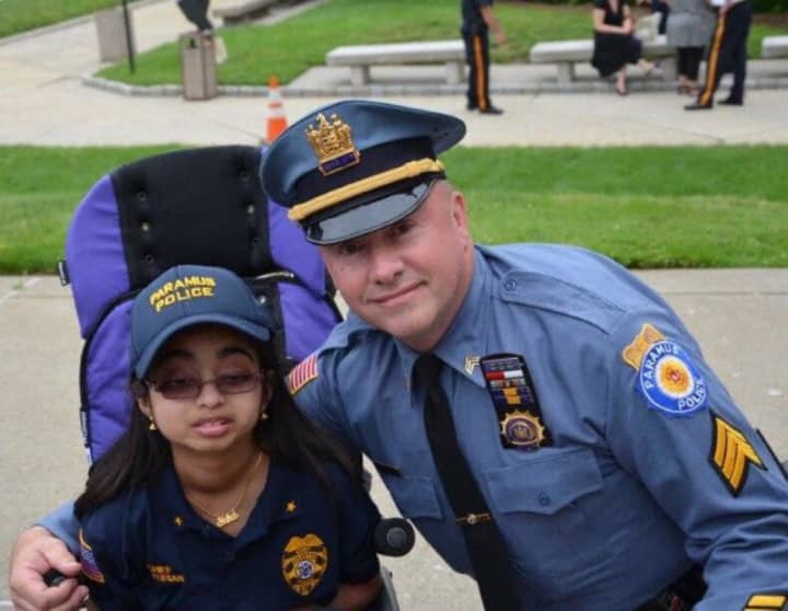 Neha Kurian and Detective Sgt. James Teehan at 2016 Chief for a Day.