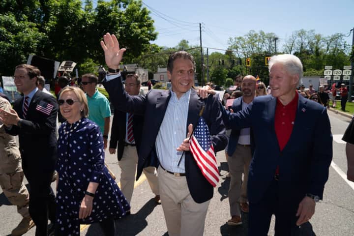 Governor Andrew M. Cuomo marches alongside former President Bill Clinton and former Secretary of State Hillary Clinton in the New Castle Memorial Day Parade on Monday, May 27.