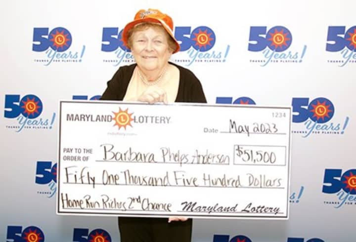 Barbara Phelps Anderson of Shady Side visited Lottery Headquarters in Baltimore on May 17, the morning after the Orioles’ 50th home run of the 2023 season made her a big winner.
