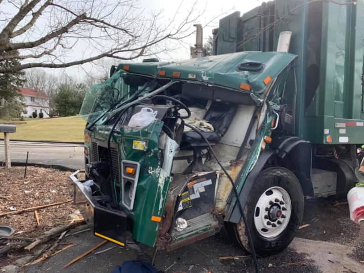 A truck driver was freed following a crash by firefighters using the Jaws of Life.