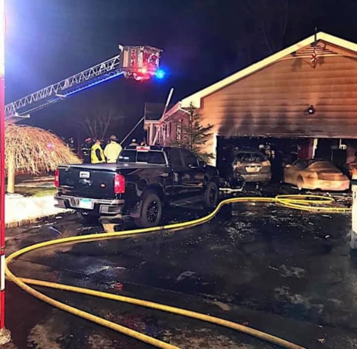 A couple of vehicles were destroyed, but the home was saved by firefighters.