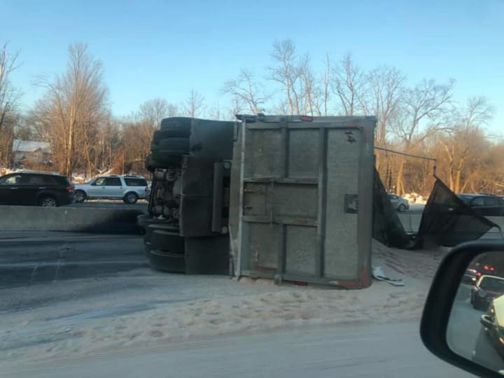 Dump truck overturned on Route 80.