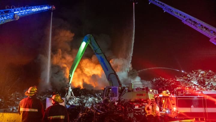 Firefighters battle a blaze at a recycling center early Wednesday morning in Worcester, Dec. 7.