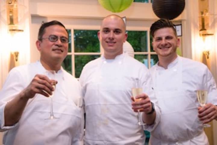 Battle of the Chefs winner Beck Bolender (center) of One Twenty One with sous chefs Jess Laguerta (left) and David Fierstein (right)