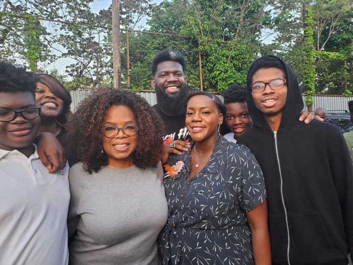 Oprah Winfrey visits West Side High School in Newark Friday. She&#x27;s seen here with students and faculty, including Principal Akbar Cook (rear, center).