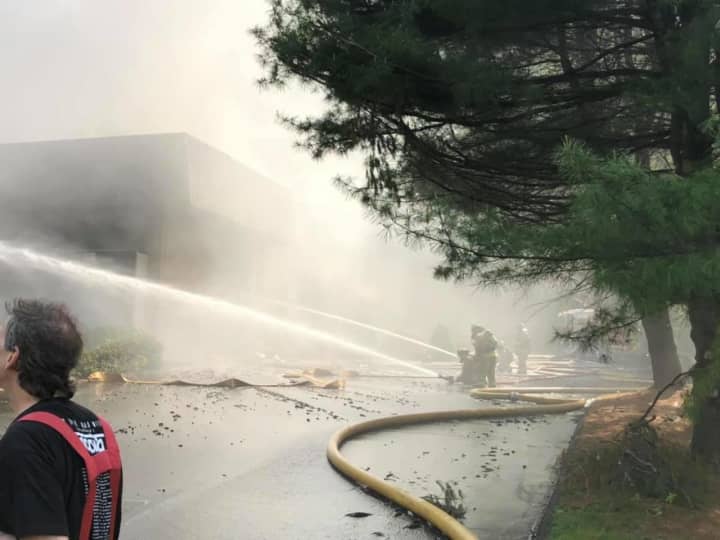 More than 100 firefighters responded to a Bethel fire at a corporate complex.
