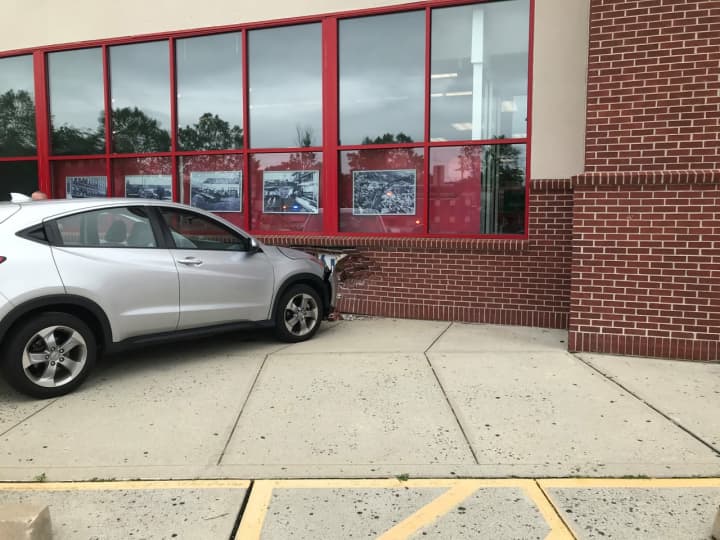 A driver lost control and drove into the side of a Norwalk CVS store.