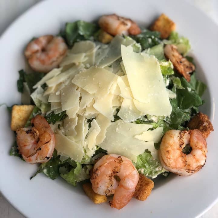 A Caesar salad with shrimp at Salt On The Water in Merrick, one of five new restaurants to try in Nassau County.