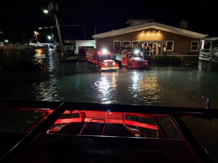 A large military-style vehicle was used by the Bay Shore Fire Department to rescue some 50 patrons and employees from a flooded restaurant.