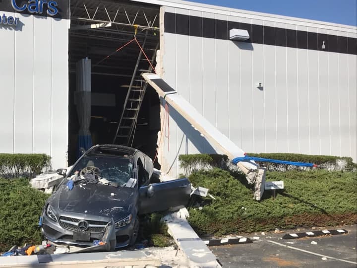 A driver hit the gas instead of the brakes and crashed through a business.