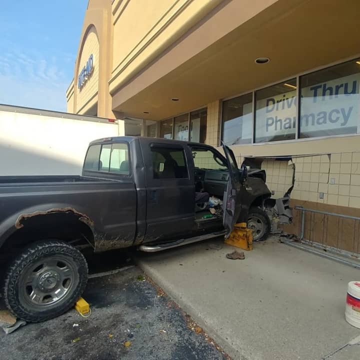A man was charged was allegedly driving high in drugs when he plowed into a local pharmacy, police say.