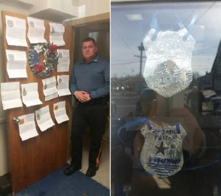 Bogota Police Sgt. Geoffrey Cole with some of the letters of appreciation from Ridgefield Park special needs students.