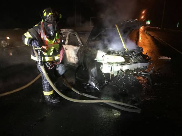 The driver of a car that caught fire on I-95 fled the scene.