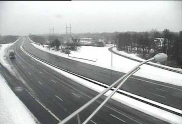I-95 is largely empty — and wet but clear of snow — on Tuesday afternoon as a snowstorm begins to taper off. The state travel ban will be lifted at 5 p.m.
