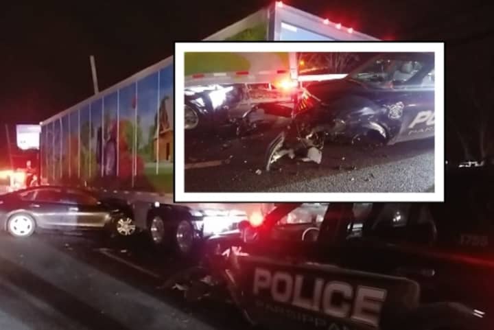 The officer was pulled over on Route 10 Wednesday to help a disabled Wegmans tractor-trailer when he was slammed from behind by a Nissan Altima, authorities said.