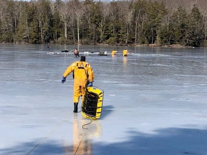 Torrington firefighters rescued six people who had fallen through the ice on a pond.