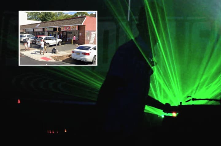 Paterson police found the entrance to an illegal after-hours club behind the building (inset).