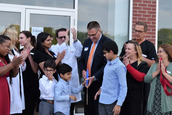The official ribbon-cutting at the grand opening of AFC Urgent Care in Shelton on Monday. See story for IDs.