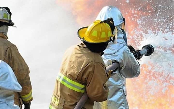 Spraying a fire with AFFF creates a film that coats the fire, blocking its oxygen supply and preventing re-ignition.